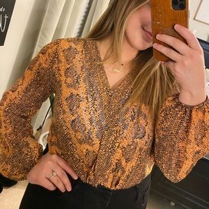 Snake print body suit. new with tags.